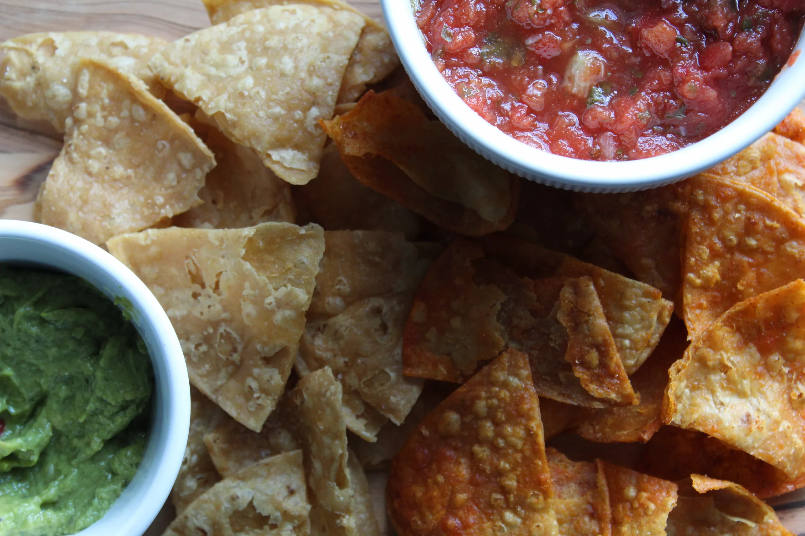 Mitten Chips Traditional and Sweet & Smokey Pepper tortilla chips served with salsa and guacamole